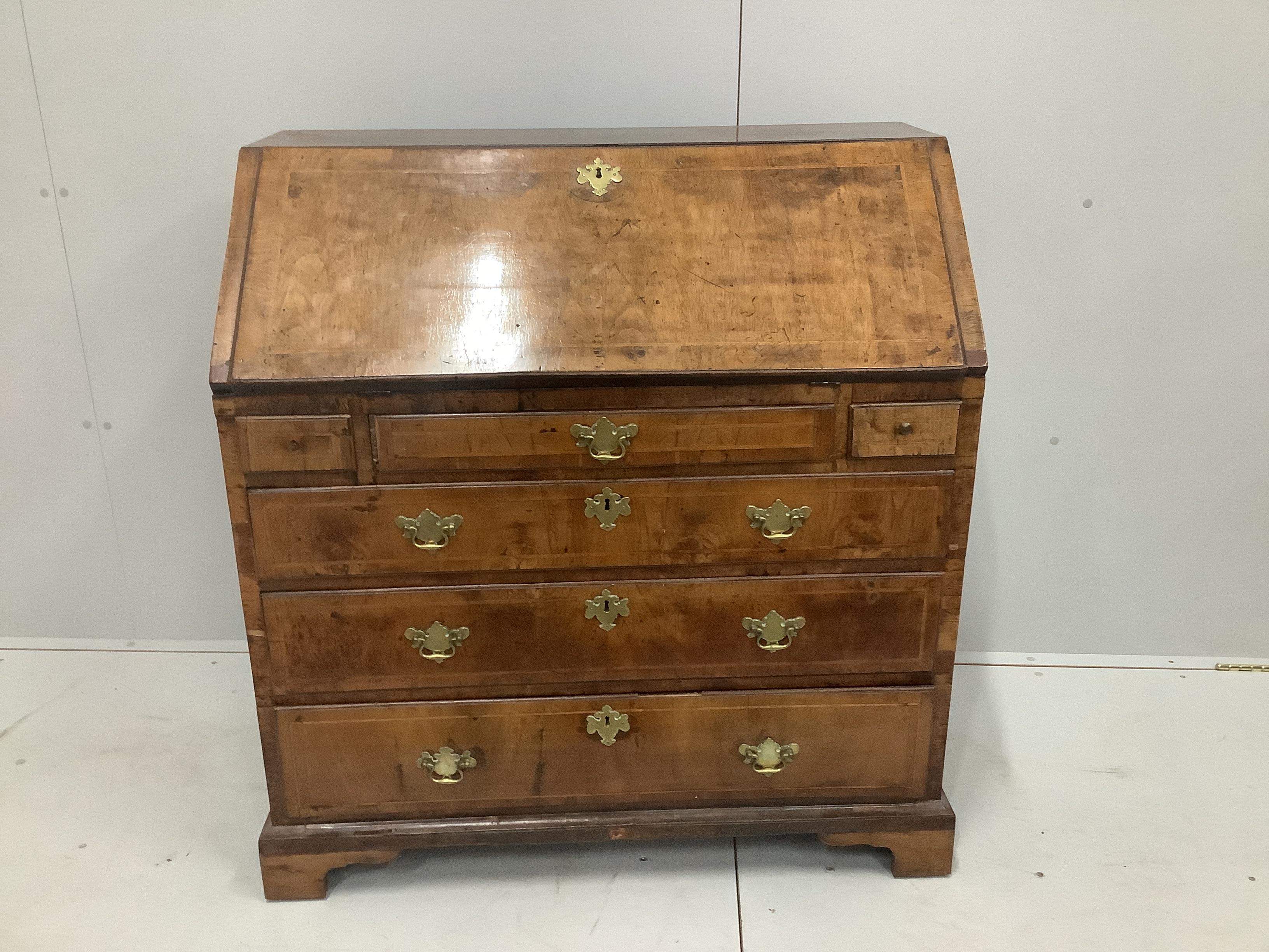 A mid 18th century walnut feather banded mahogany bureau, width 99cm